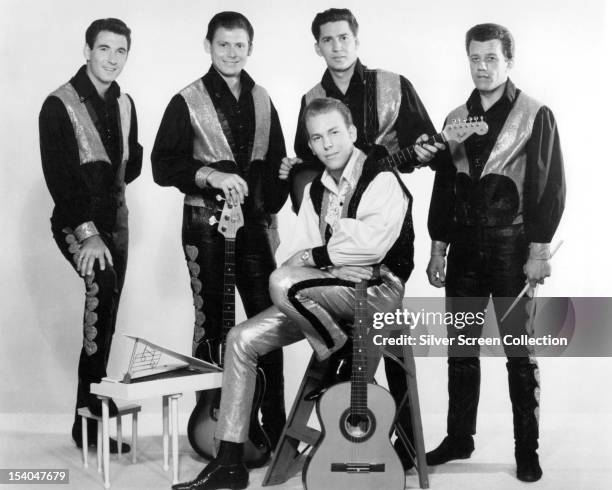 American country singer-songwriter and musician Hank Williams, Jr and his band, circa 1965.