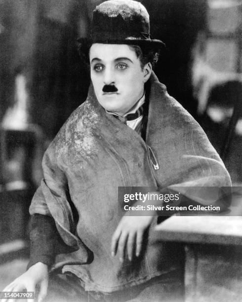 British comic actor and director Charlie Chaplin , as the Little Tramp, in a publicity still for the silent comedy 'The Gold Rush' directed by...