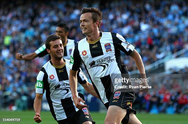 Ryan Griffiths of the Jets celebrates after scoring his team's first goal during the round two A-League match between Sydney FC and the Newcastle...