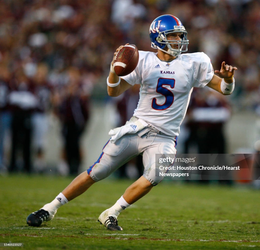 Dirk Reesing Kansas quarterback Todd Reesing tries to slip an on comming Texas A&M ...