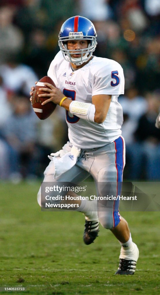 Dirk Reesing Kansas quarterback Todd Reesing looks for an open receiver as he ...