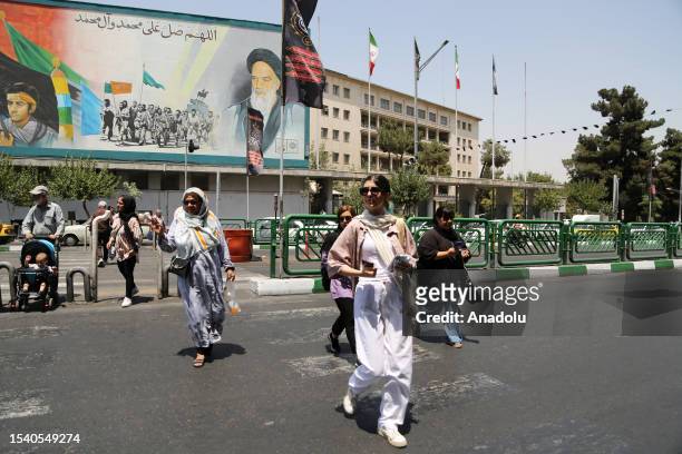 Women walk on the streets during daily life as the country's morality police resume hijab patrols in Tehran, Iran on July 18, 2023. ''Prosecutors in...