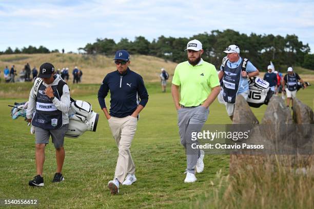 Rickie Fowler of the United States and Tyrrell Hatton of England walk to the 18th green during Day One of the Genesis Scottish Open at The...