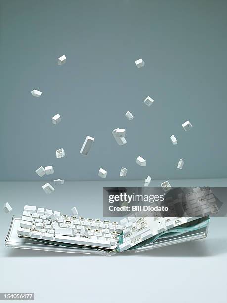 breaking keyboard with keys flying - keypad stock pictures, royalty-free photos & images