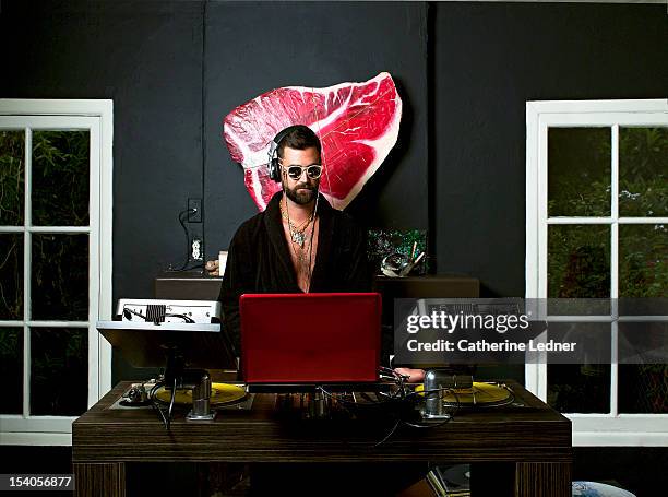 man at dj table at home - dj table stock pictures, royalty-free photos & images