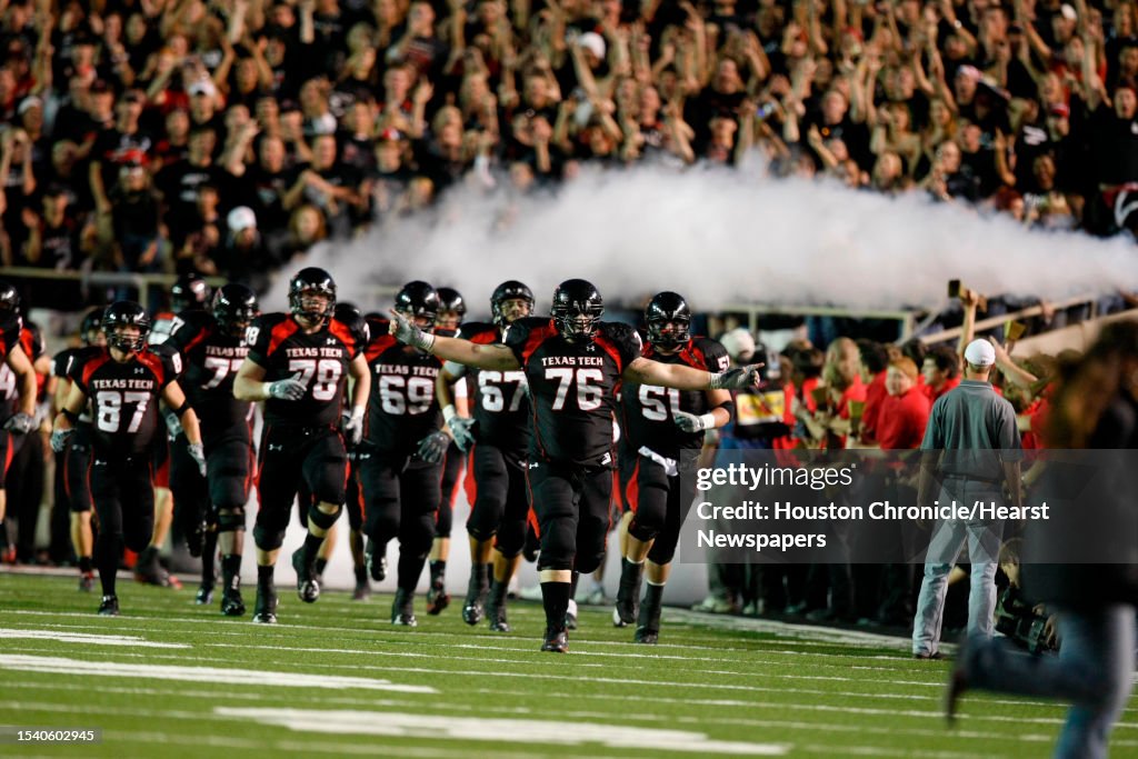 Tech Offensive Line Texas Tech offensive lineman Brandon Carter leads his team onto the ...