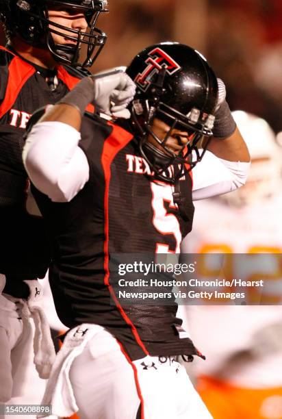 Texas Tech wide receiver Michael Crabtree flexes his muscles after scoring a touchdown in the second quarter of his game against Oklahoma State...