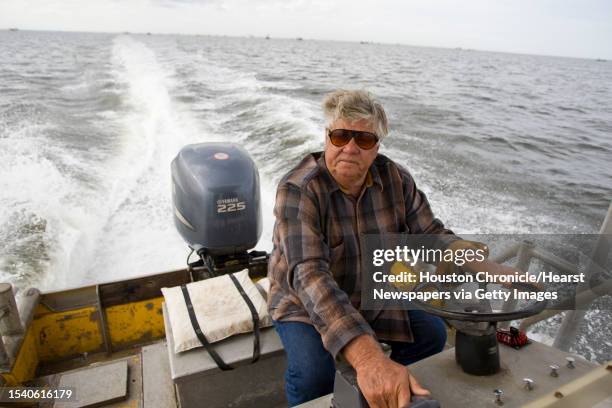 Ben Nelson of Jeri's Seafood rides his skiff boat to check on his fishermen Wednesday, Nov. 26 in Smith Point. Nelson is concerned with the...