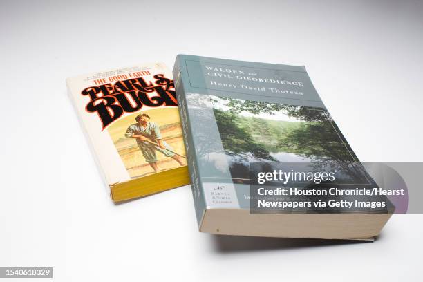 Used copies of books that celebrate the earth: On Walden Pond by Henry David Thoreau and The Good Earth by Pearl S. Buck. Photographed in the...