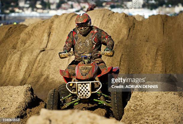 Davey Nixon rides his quad bike through the dunes during the main quad and sidecar race during the 2012 RHL Weston beach race in Weston-Super-Mare,...