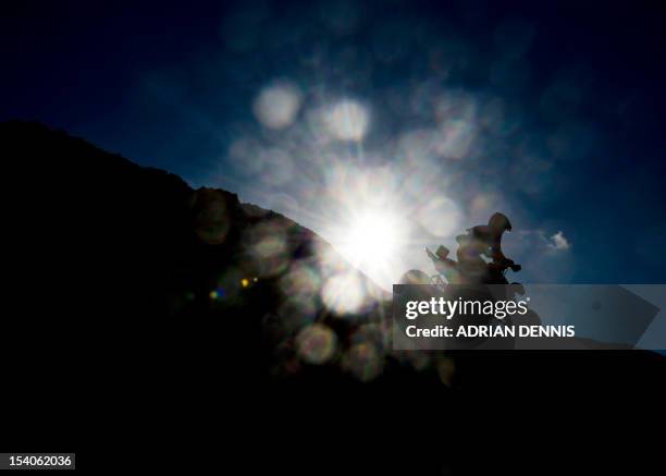 Quad bike rider comes over the crest of a dune during the main quad and sidecar race during the 2012 RHL Weston beach race in Weston-Super-Mare,...