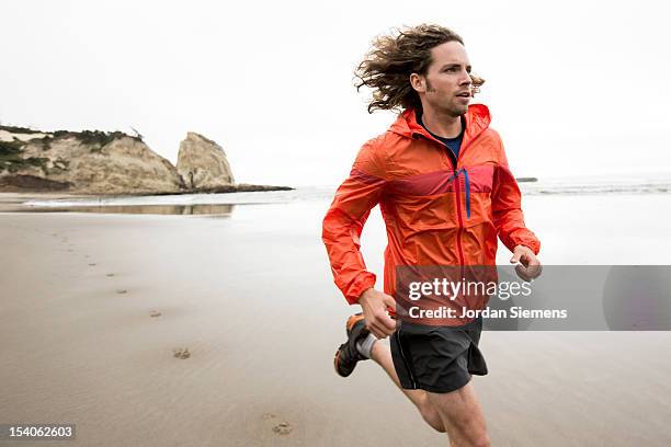 trail running in oregon. - young men running stock pictures, royalty-free photos & images
