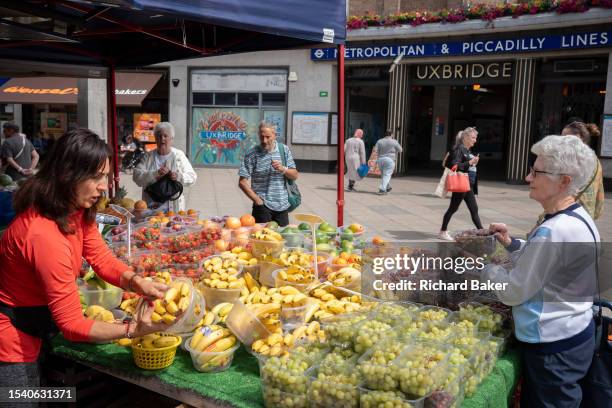 Two days before the political by-election, residents shop for fruit and veg outside Uxbridge tube station, on 18th July 2023, in London, England. The...