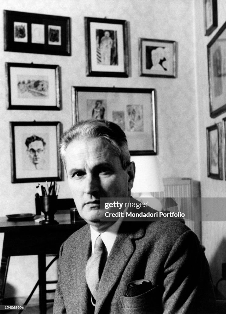 Portrait of the Italian writer Carlo Cassola at his home. Hanging on