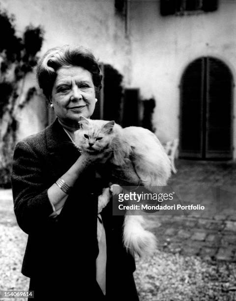 Italian writer and translator Anna Banti holding her cat. 1960s