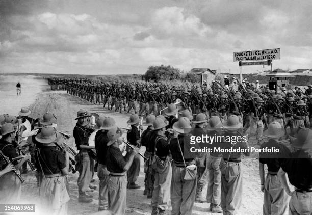 On the southern front, a group of Italian soldiers playing on the passing of the Italian infantry soldiers of the 221st Blackshirts Legion "Fasci...