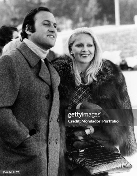 Italian actress Virna Lisi smiling with her husband Franco Pesci. Cortina d'Ampezzo, 1973