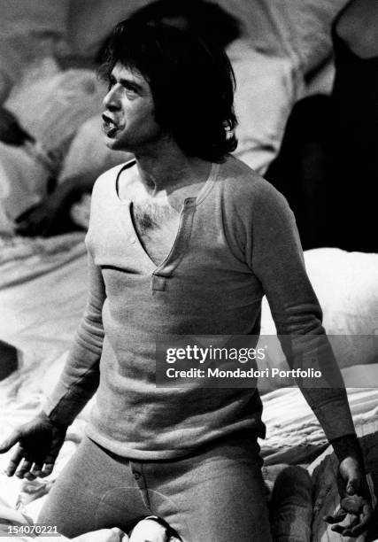 The Italian actor Corrado Pani getting down on his knees in a scene of the play Peer Gynt staged at Teatro Valle