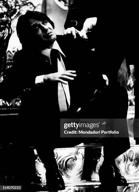 The Italian actor Corrado Pani sitting on a step in the play The Life and Death of King John staged at Teatro Metastasio. Prato, 1973