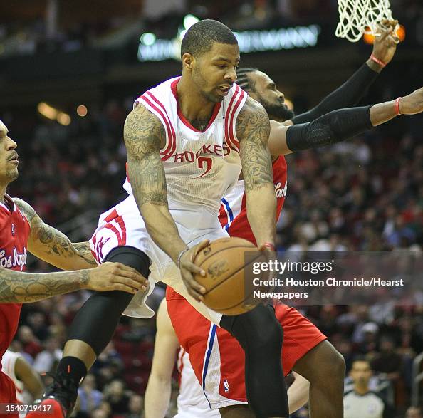 Houston Rockets Marcus Houston Rockets forward Marcus Morris gets a rebound over Los Angeles ...