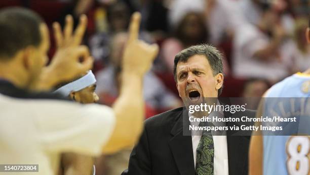 Houston Rockets head coach Kevin McHale accuses a Denver Nuggets of flopping as Houston Rockets shooting guard James Harden is called for a foul...