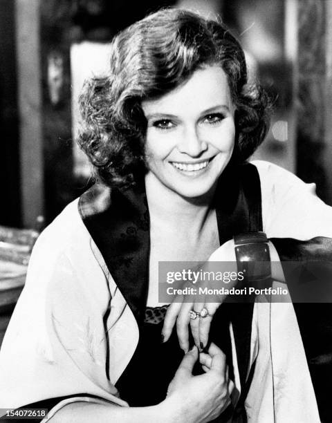 Italian actress Laura Antonelli smiling on the set of the film Till Marriage Do Us Part. Rome, 1974