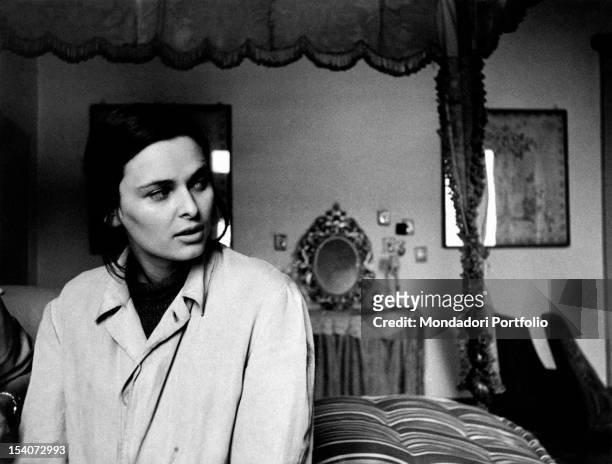 The Italian actress Lucia Bose sitting on a bed in the film Abandoned. Ripalta Guerina, 1950s