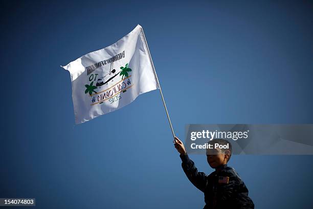 Kevin Alcaraz waves a flag as the Space Shuttle Endeavour is moved to the California Science Center on October 13, 2012 in Inglewood, California. The...