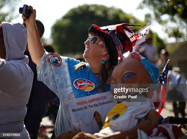 Woman photographs the Space Shuttle Endeavour as it is moved to the California Science Center on October 13, 2012 in Inglewood, California. The space...