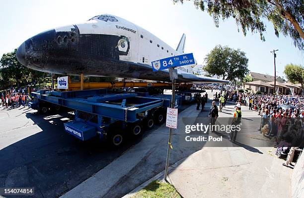 Crowd gathers to watch as the Space Shuttle Endeavour is moved to the California Science Center on October 13, 2012 in Inglewood, California. The...