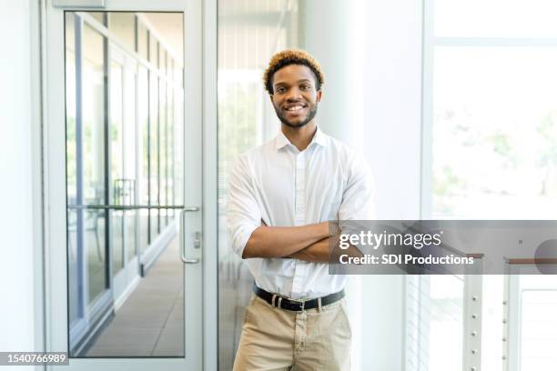 young adult male entrepreneur poses for photo - candidate experience stock pictures, royalty-free photos & images