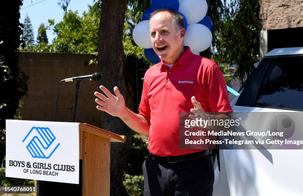 Long Beach, CA Krister Terito of Bridgestone Retail Operations talks to children at the Boys & Girls Clubs of Long Beach as they gathered show their...