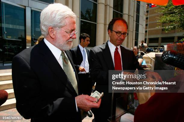 George Parnham , Andrea Yates' attorney, is surrounded by the media as he buys lunch for his legal team at a hot dog stand in front of the Harris...