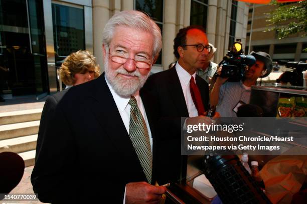 George Parnham , Andrea Yates' attorney, is surrounded by the media as he buys lunch for his legal team at a hot dog stand in front of the Harris...