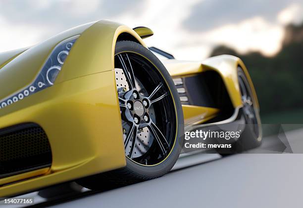 yellow sport car from low view - supercar stockfoto's en -beelden