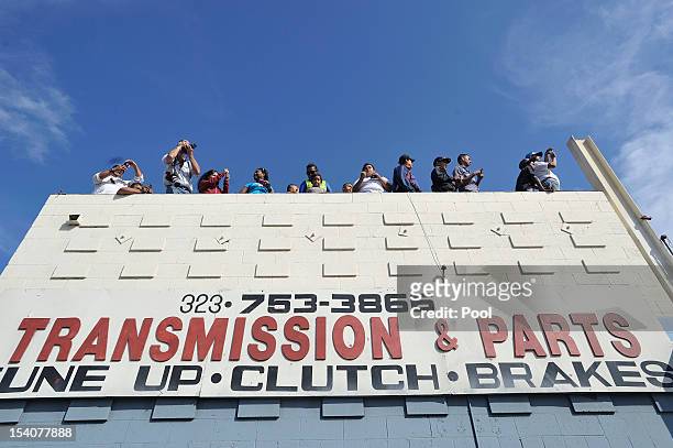 Crowds watch Space Shuttle Endeavour's on Crenshaw Blvd. Enroute to the California Science Center during its final journey on October 13, 2012 in...