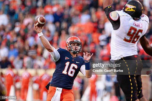 Quarterback Michael Rocco of the Virginia Cavaliers throws the ball over defensive lineman A.J. Francis of the Maryland Terrapins at Scott Stadium on...