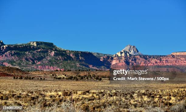 scenic view of rocky mountains against clear blue sky,utah,united states,usa - vermilion cliffs imagens e fotografias de stock