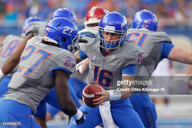 Joe Southwick of the Boise State Broncos hands off the ball to Jay Ajayi during the game against the Fresno State Bulldogs at Bronco Stadium on...