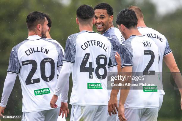 Ben Cabango of Swansea City celebrates scoring with his team mates during a pre-season friendly match between Swansea City and Newport County at the...