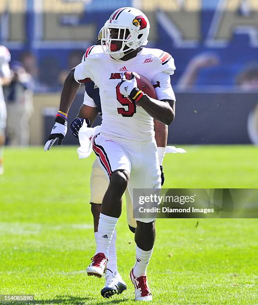 Receiver DeVante Parker of the Louisville Cardinals runs with the football to the endzone for the touchdown after a catch during a game with the...