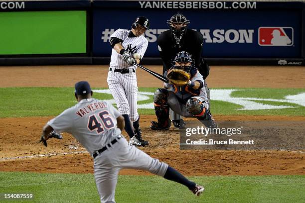 Ichiro Suzuki of the New York Yankees hits a 2-run home run in the bottom of the ninth inning off of Jose Valverde of the Detroit Tigers during Game...