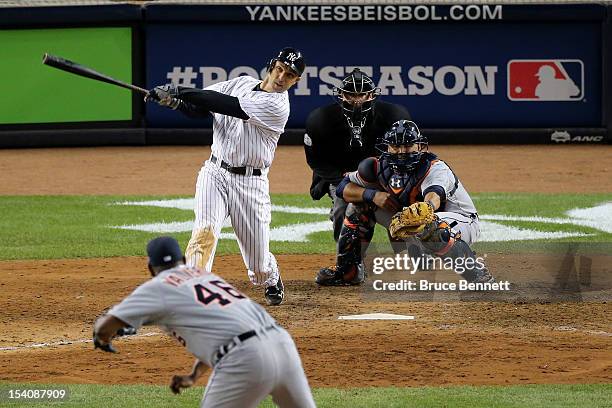 Raul Ibanez of the New York Yankees hits a 2-run home run in the bottom the ninth inning off of Jose Valverde of the Detroit Tigers during Game One...