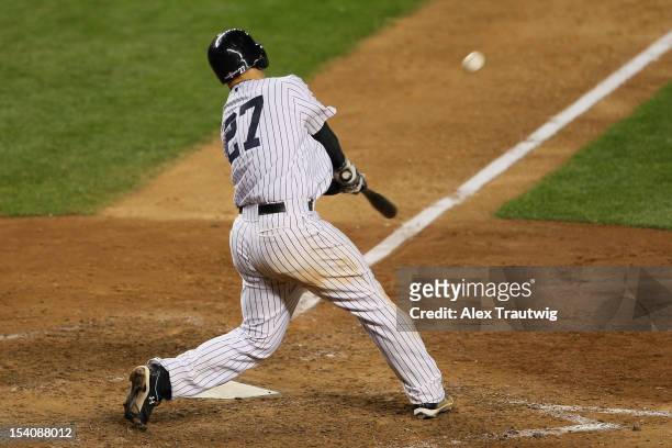 Raul Ibanez of the New York Yankees hits a 2-run home run in the bottom of the ninth inning againt the Detroit Tigers during Game One of the American...