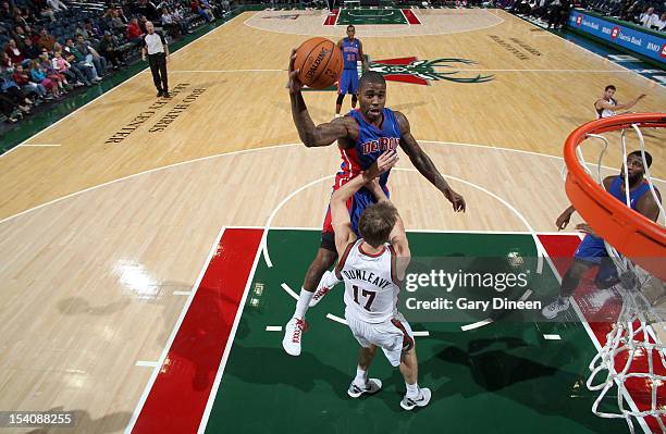 Terrence Williams of the Detroit Pistons shoots against Mike Dunleavy of the Milwaukee Bucks during the NBA preseason game on October 13, 2012 at the...