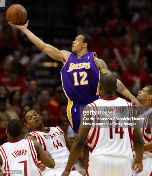 Los Angeles Lakers guard Shannon Brown shoots over Houston Rockets forward Chuck Hayes during fourth quarter action in game three of the Western...