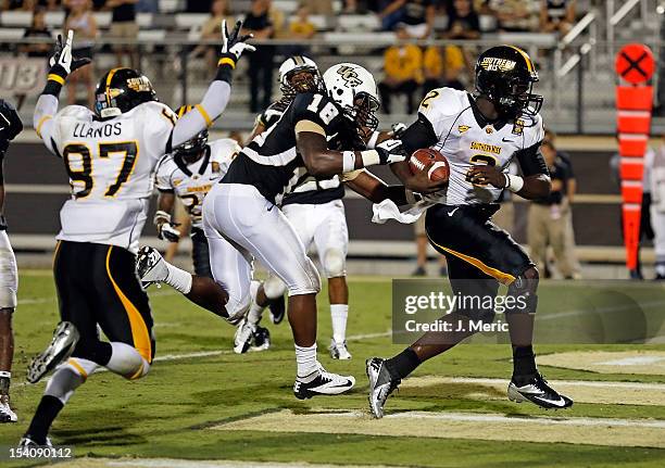 Quarterback Anthony Alford of the Southern Mississippi Golden Eagles scores a touchdown in the first overtime against the Central Florida Knights...