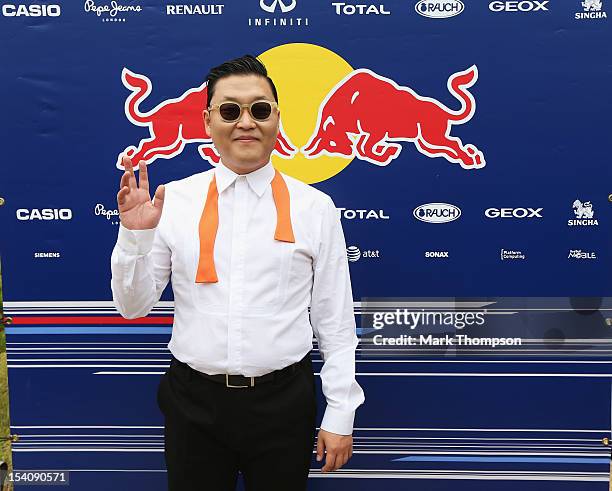 Korean rapper Psy visits the Red Bull Racing garage before the Korean Formula One Grand Prix at the Korea International Circuit on October 14, 2012...