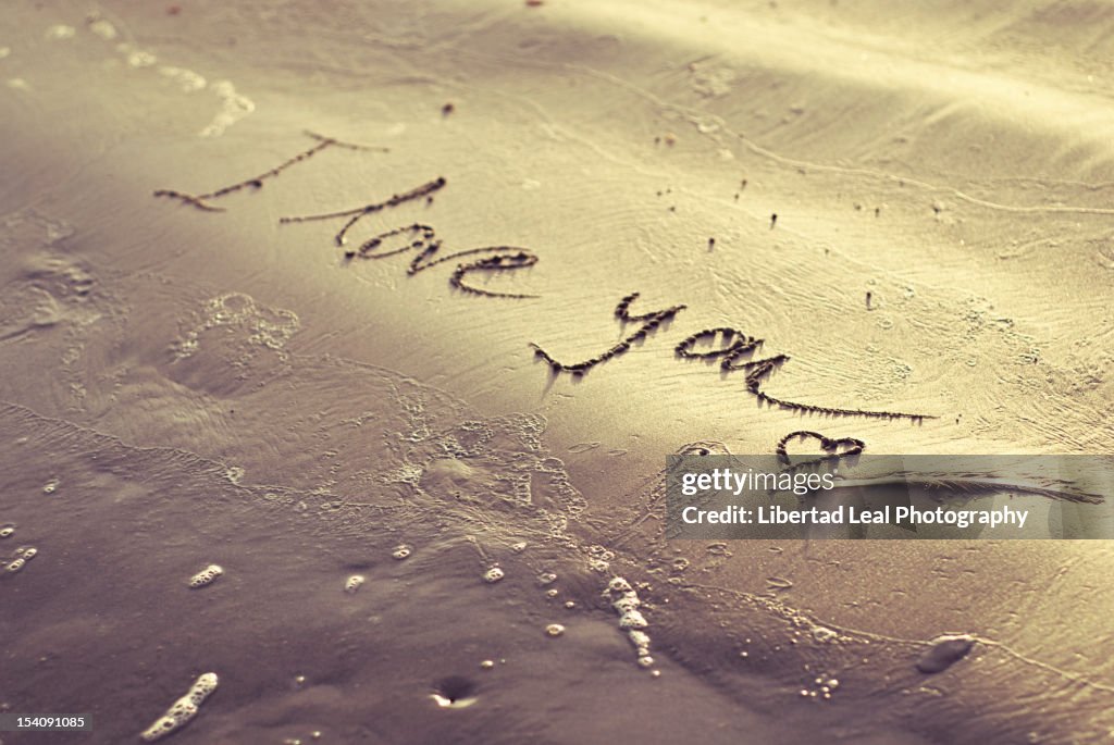 I love you written on sand