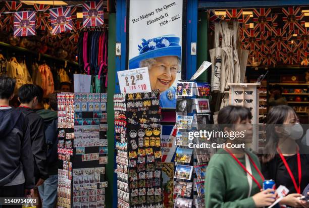 Picture of Queen Elizabeth II is displayed outside a souvenir shop in Leicester Square on July 18, 2023 in London, England. The proliferation of...